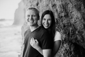 black and white engagement photo on the beach